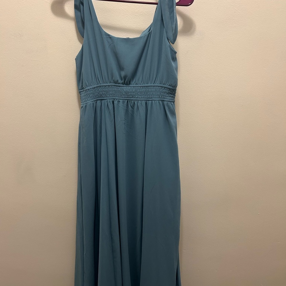 Flattering and flowy silvery/blue dress.
